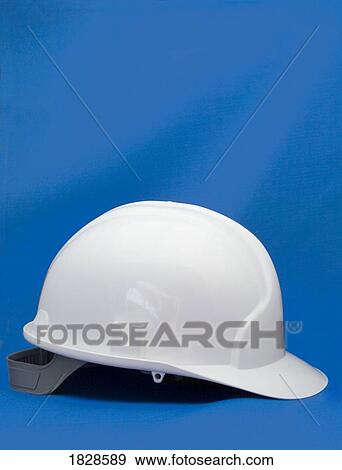 Stock Photo - Hard hat on blue background. Fotosearch
