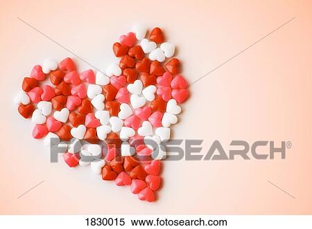 Stock Photography - Heart-shaped candies forming heart shape. Fotosearch