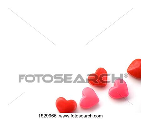 Heart-shaped candies on white background View Large Photo Image Stock Photograph - Heart-shaped candies on white background. Fotosearch