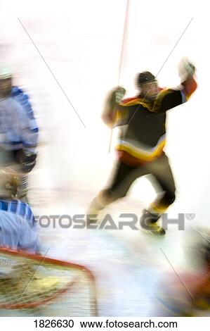 Stock Image - Hockey player celebrating a goal. Fotosearch