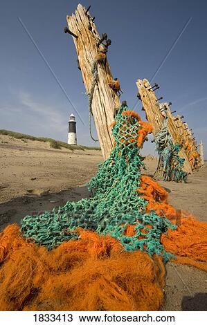 Humberside, England; Net and old posts View Large Photo Image Stock Image - Humberside, England; Net and old posts. Fotosearch