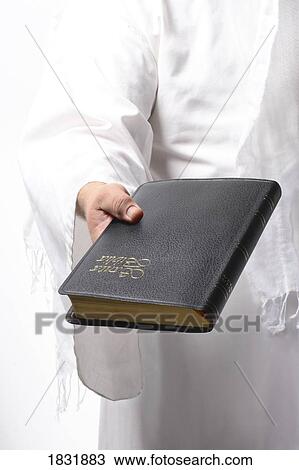 Jesus holding the Bible View Large Photo Image Stock Image - Jesus holding the Bible. Fotosearch