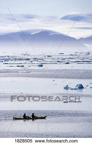 Kayaking ice berg off coast of Nunavut, Canada View Large Photo Image Stock Photography - Kayaking ice berg off coast of Nunavut, Canada. Fotosearch