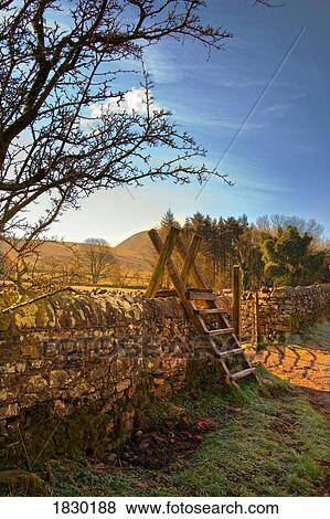 Ladder over stone wall, Lake District, Cumbria, England View Large Photo Image Stock Photo - Ladder over stone wall, Lake District, Cumbria, England. Fotosearch
