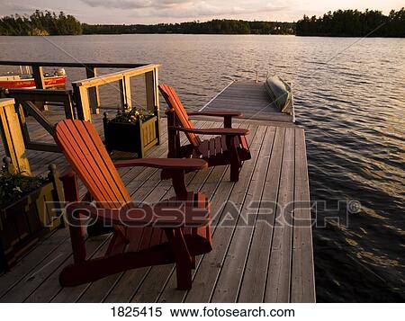 Stock Photography - Lake of the Woods, Ontario, Canada, Chairs by a lake. Fotosearch