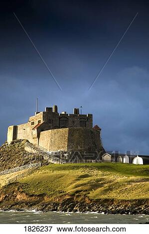 Lindisfarne Castle on a volcanic mound called Beblowe Craig, Holy Island, Bewick, England View Large Photo Image Stock Photo - Lindisfarne Castle on a volcanic mound called Beblowe Craig, Holy Island, Bewick, England. Fotosearch