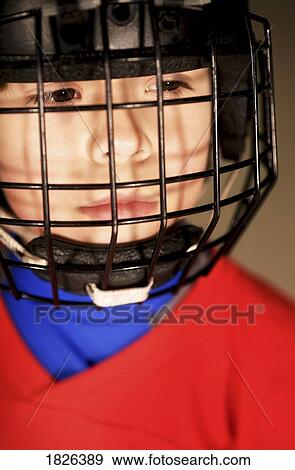 Little boy in hockey helmet View Large Photo Image Stock Photo - Little boy in hockey helmet. Fotosearch