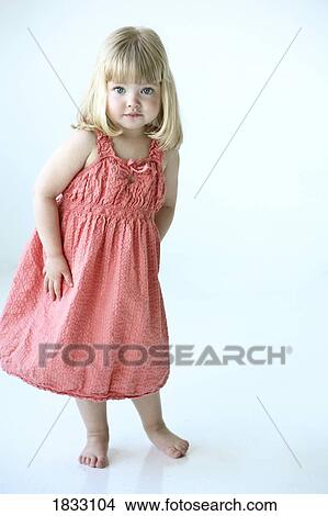 Little girl in a pink dress View Large Photo Image Picture - Little girl in a pink dress. Fotosearch