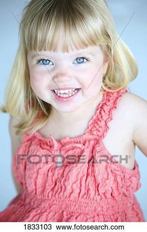 Little girl in a pink dress View Large Photo Image Stock Image - Little girl in a pink dress. Fotosearch