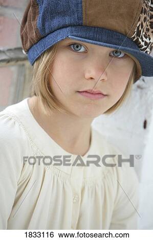 Stock Photograph - Little girl in blue hat. Fotosearch