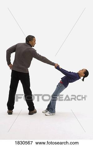 Stock Photo - Little girl pulling dad's hand. Fotosearch