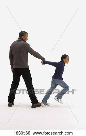 Stock Photo - Little girl pulling dad's hand. Fotosearch