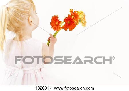 Little girl with flowers View Large Photo Image Stock Photo - Little girl with flowers. Fotosearch