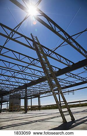 Low angle view of ladder and building framing View Large Photo Image Stock Photo - Low angle view of ladder and building framing. Fotosearch
