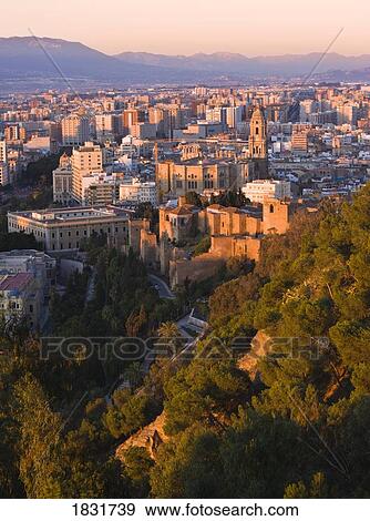 Stock Photo - Malaga, Costa del Sol, Spain, view of the city and walls of the Alcazaba. Fotosearch