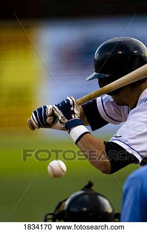Stock Image - Man playing baseball. Fotosearch