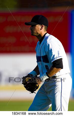 Stock Photo - Man playing baseball. Fotosearch