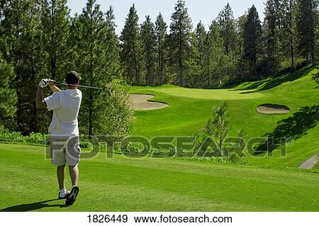 Stock Photo - Man playing golf. Fotosearch