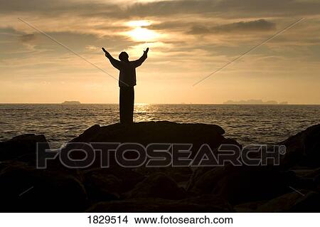 Man praying at a beach, Koh Lanta, Thailand View Large Photo Image Picture - Man praying at a beach, Koh Lanta, Thailand. Fotosearch