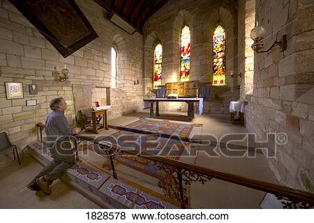 Man praying in chapel, Holy Island, Bewick, England View Large Photo Image Stock Photo - Man praying in chapel, Holy Island, Bewick, England. Fotosearch