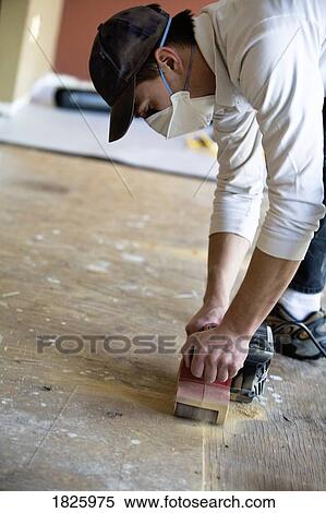 Man sanding a floor View Large Photo Image Stock Photography - Man sanding a floor. Fotosearch
