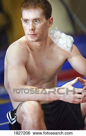 Man with ice pack on his shoulder View Large Photo Image Stock Photograph - Man with ice pack on his shoulder. Fotosearch