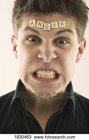 Man with the word "anger" spelled with letter tiles on his head View Large Photo Image Stock Image - Man with the word "anger" spelled with letter tiles on his head. Fotosearch