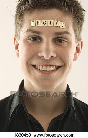 Man with the word "choice" spelled with letter tiles on his head View Large Photo Image Stock Photo - Man with the word "choice" spelled with letter tiles on his head. Fotosearch