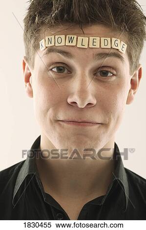 Man with the word 'knowledge' spelled with letter tiles on his head View Large Photo Image Stock Photography - Man with the word 'knowledge' spelled with letter tiles on his head. Fotosearch