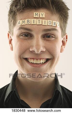 Man with the words 'my ambitions' spelled with letter tiles on his head View Large Photo Image Stock Photo - Man with the words 'my ambitions' spelled with letter tiles on his head. Fotosearch
