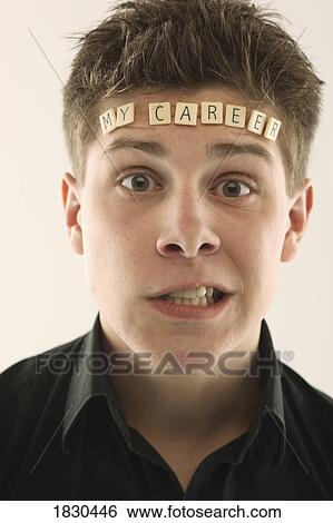 Stock Photograph - Man with the words 'my career' spelled with letter tiles on his head. Fotosearch