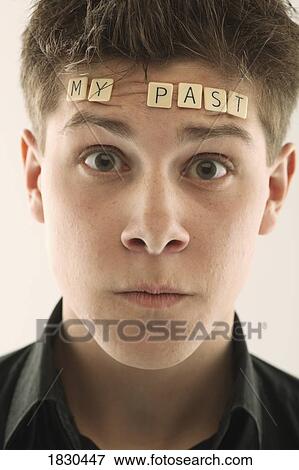 Man with the words 'my past' spelled with letter tiles on his head View Large Photo Image Stock Photo - Man with the words 'my past' spelled with letter tiles on his head. Fotosearch