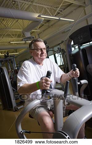 Man working out in the gym View Large Photo Image Stock Photo - Man working out in the gym. Fotosearch