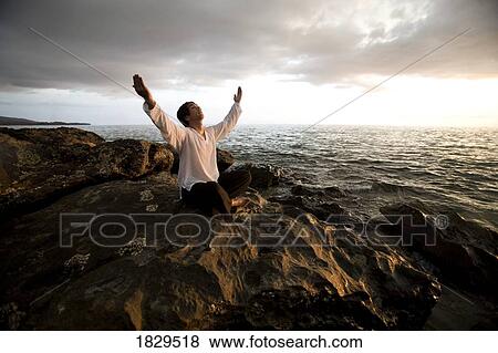 Stock Photo - Man worshipping, Koh Lanta, Thailand, Asia. Fotosearch