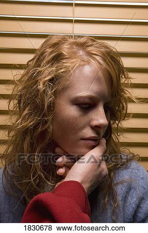 Stock Photo - Man's hand touching a woman's face. Fotosearch