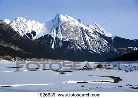 Stock Photograph - Medicine Lake, Maligne Range, Jasper National Park, Alberta, Canada. Fotosearch