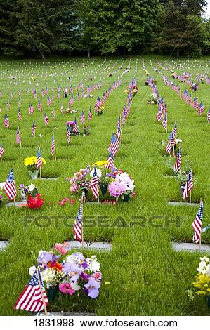Memorial Flowers And Flags In A Graveyard In Oregon, USA View Large Photo Image Stock Photo - Memorial Flowers And Flags In A Graveyard In Oregon, USA. Fotosearch