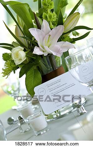 Menu card on table next to flower vase View Large Photo Image Stock Photo - Menu card on table next to flower vase. Fotosearch