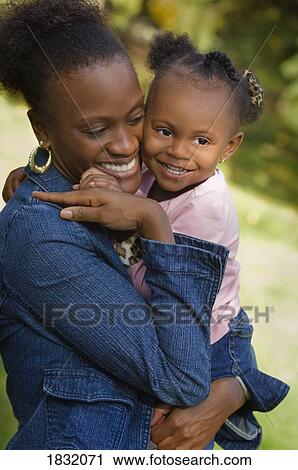 Mother and daughter hugging View Large Photo Image Stock Image - Mother and daughter hugging . Fotosearch