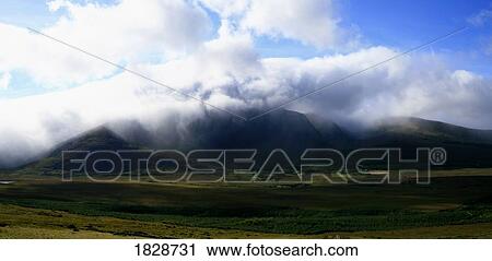 Stock Image - Mount Brandon in Mist near Dingle, Kerry, Ireland. Fotosearch