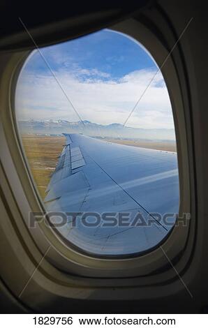 Mountains as seen from airplane window View Large Photo Image Stock Photograph - Mountains as seen from airplane window. Fotosearch