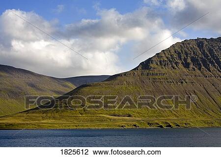 Stock Image - Mountains in Isafjordur, West Fjords Region, Iceland . Fotosearch