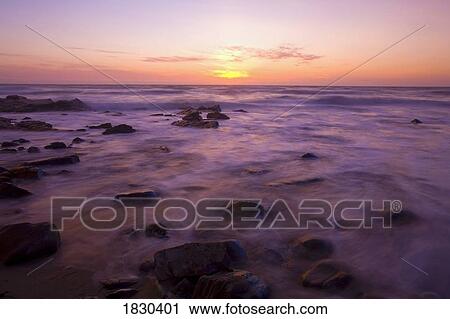 Stock Image - Ocean at sunset. Fotosearch