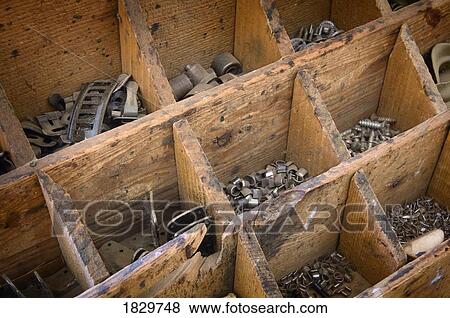 Stock Photo - Old fashioned hardware in wooden box. Fotosearch
