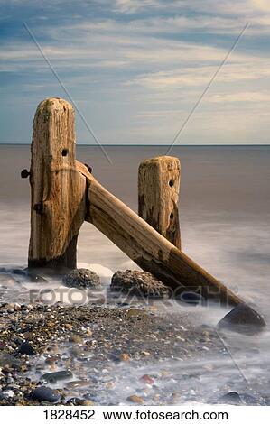 Stock Image - Old post in sea. Fotosearch