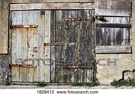 Stock Image - Old wooden door of building. Fotosearch
