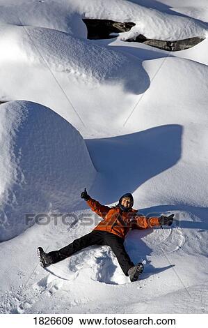 Stock Photo - Person making snow angels. Fotosearch