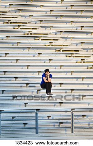 Person on bleachers View Large Photo Image Stock Image - Person on bleachers. Fotosearch