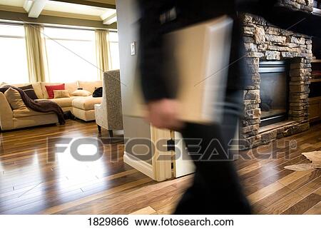 Stock Photograph - Person walking through house. Fotosearch