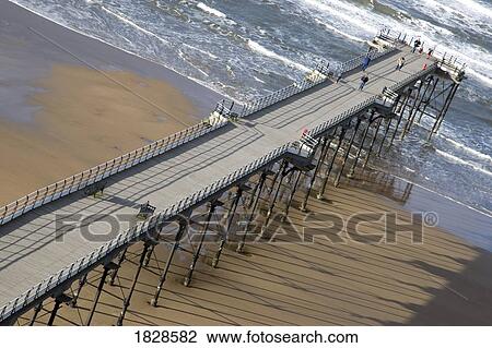 Stock Image - Pier on beach, Saltburn, North Yorkshire, England. Fotosearch